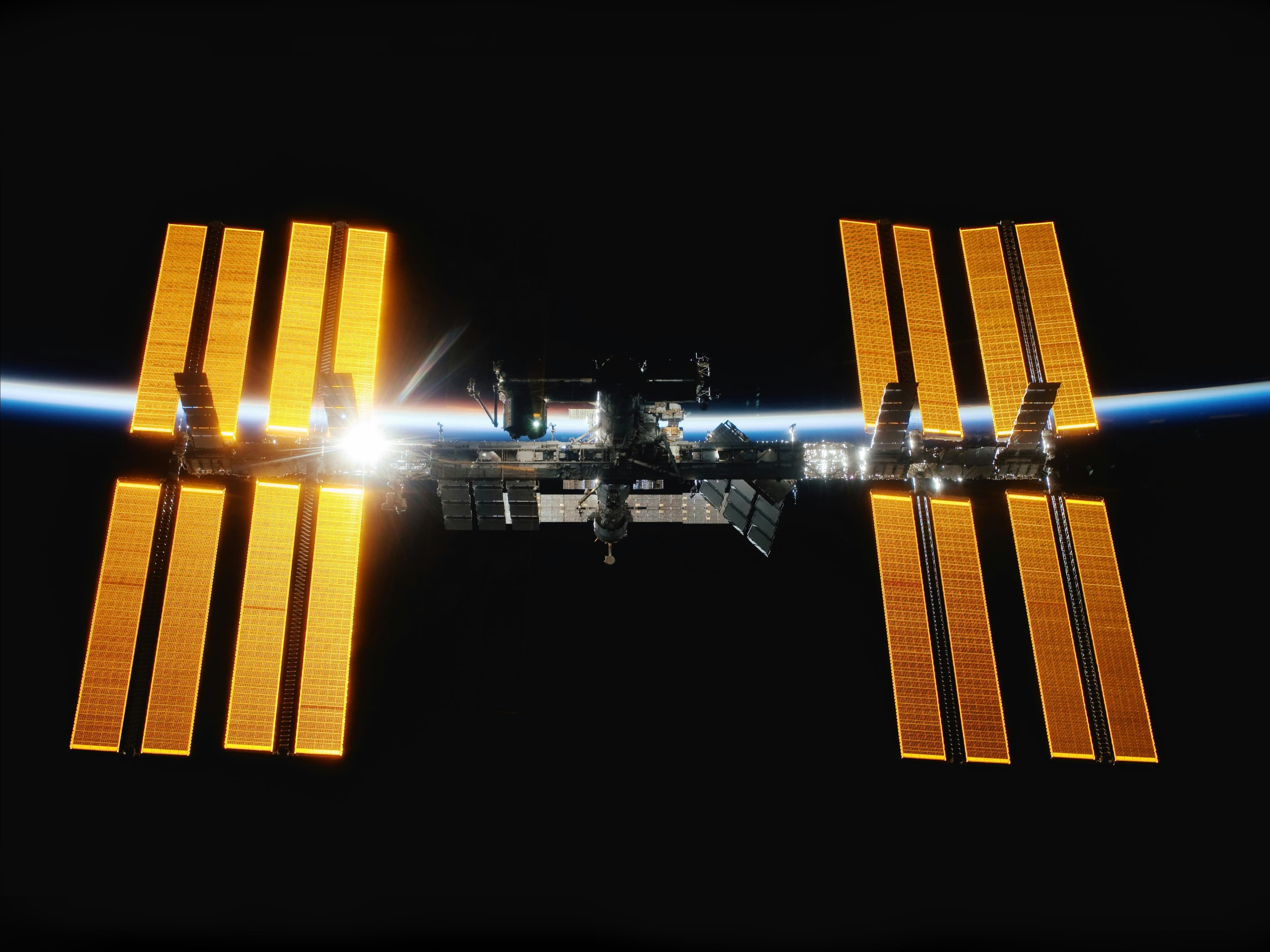 Earth and space station with sun flare, Team Rocket project hero